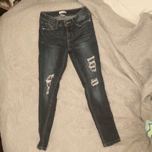 Hi I’m selling a dark blue pair of ripped jeans